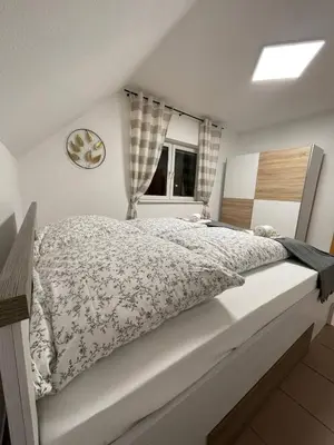 Ein Bett oder Betten in einem Zimmer der Unterkunft Rheinview Sunset Apartment Urbar