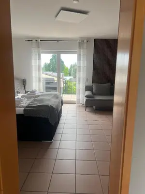 Ein Bett oder Betten in einem Zimmer der Unterkunft Rheinview Sunset Apartment Urbar