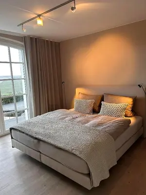 Ein Bett oder Betten in einem Zimmer der Unterkunft Ferienwohnung 