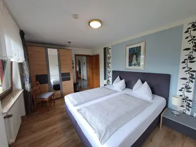 Ein Bett oder Betten in einem Zimmer der Unterkunft Ferienwohnungen Blum