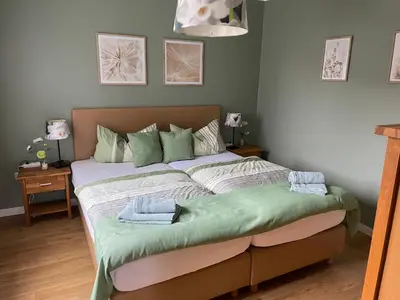 Ein Bett oder Betten in einem Zimmer der Unterkunft Traumhaus am Maar 2