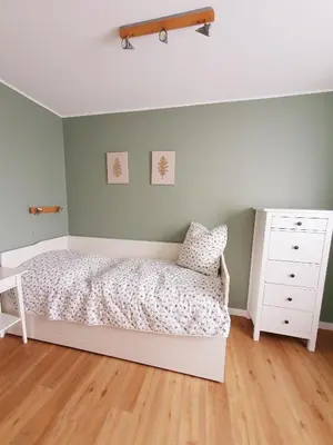 Ein Bett oder Betten in einem Zimmer der Unterkunft Traumhaus am Maar 2