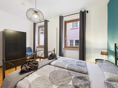 Ein Bett oder Betten in einem Zimmer der Unterkunft Rustikal trifft Modern, Bar Keller, Terrasse, 2 Schlafzimmer