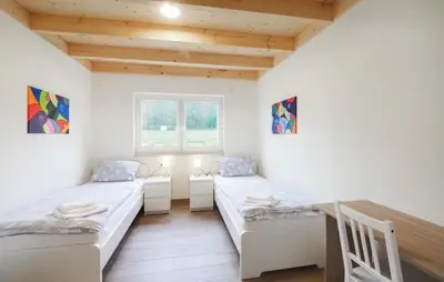Ein Bett oder Betten in einem Zimmer der Unterkunft Ferienpark Wolfsschlucht