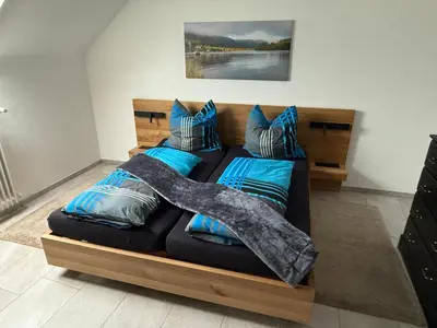 Ein Bett oder Betten in einem Zimmer der Unterkunft Moselkieker
