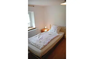 Ein Bett oder Betten in einem Zimmer der Unterkunft 3 Bedroom Cozy Apartment In Trierweiler