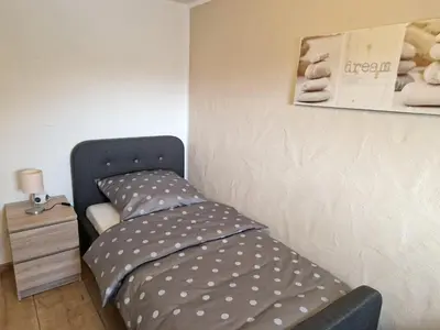 Ein Bett oder Betten in einem Zimmer der Unterkunft Ferienwohnung am Wasserfall