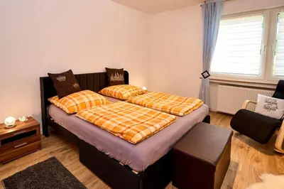 Ein Bett oder Betten in einem Zimmer der Unterkunft Ferienwohnung Haus Waldblick