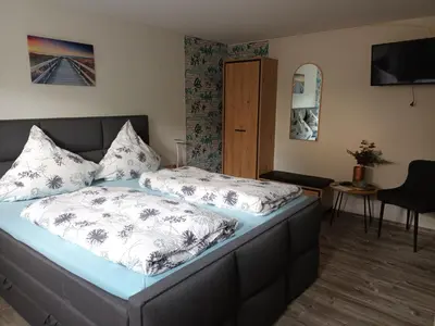 Ein Bett oder Betten in einem Zimmer der Unterkunft Gästehaus A21