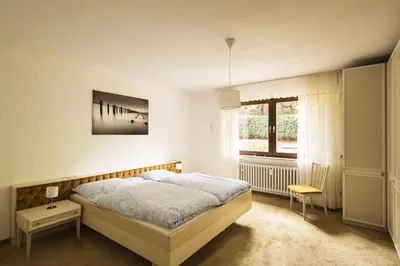 Ein Bett oder Betten in einem Zimmer der Unterkunft Ferienwohnungen Casa Ri(e)sig