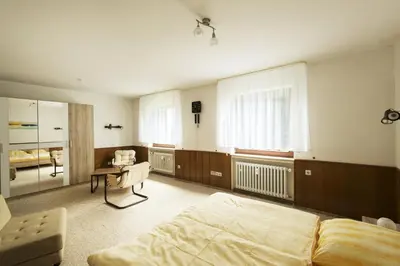 Ein Bett oder Betten in einem Zimmer der Unterkunft Ferienwohnungen Casa Ri(e)sig