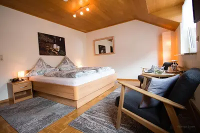 Ein Bett oder Betten in einem Zimmer der Unterkunft Wein- und Gästehaus Lentes