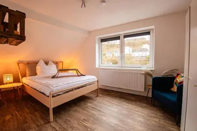Ein Bett oder Betten in einem Zimmer der Unterkunft Queensize Bett & Netflix zentral