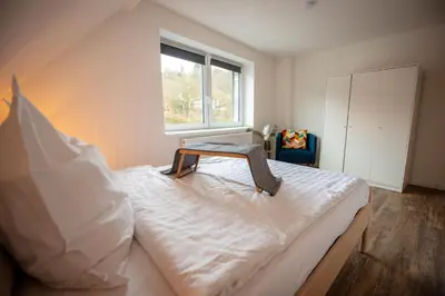 Ein Bett oder Betten in einem Zimmer der Unterkunft Queensize Bett & Netflix zentral