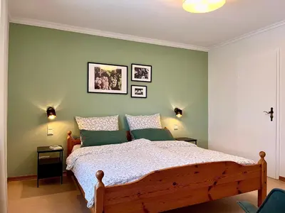 Ein Bett oder Betten in einem Zimmer der Unterkunft Pension 1595 im Weingut Botzet