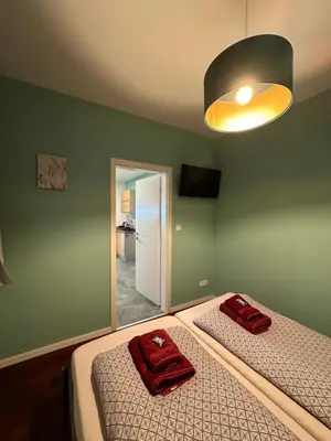 Ein Bett oder Betten in einem Zimmer der Unterkunft Relaxen im Weindorf Mayschoß Fewo 1