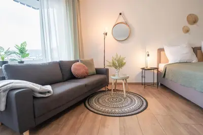 Ein Bett oder Betten in einem Zimmer der Unterkunft DDHomes LahnLiebe App 01 - Balkon,Therme,SmartTV