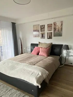 Ein Bett oder Betten in einem Zimmer der Unterkunft Pension mit Moselblick