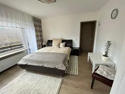 Ein Bett oder Betten in einem Zimmer der Unterkunft Pension mit Moselblick