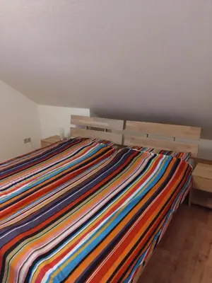 Ein Bett oder Betten in einem Zimmer der Unterkunft Ferienwohnung Veldenz