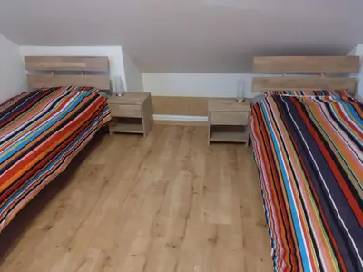 Ein Bett oder Betten in einem Zimmer der Unterkunft Ferienwohnung Veldenz