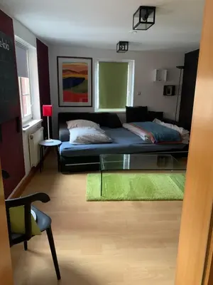 Ein Bett oder Betten in einem Zimmer der Unterkunft Am Zwingelbrunnen in der Altstadt
