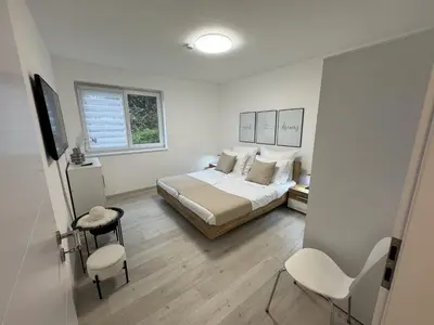 Ein Bett oder Betten in einem Zimmer der Unterkunft Neue Wohnung für 5 Küche Terrasse