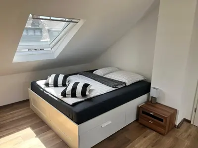 Ein Bett oder Betten in einem Zimmer der Unterkunft Charmante 1-Zimmer-Wohnung in Koblenz mit Küche & kostenlosen Parkplätzen