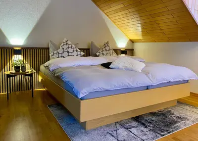 Ein Bett oder Betten in einem Zimmer der Unterkunft Fewo-zum-Nussbaum - Mosel 2