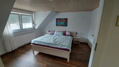 Ein Bett oder Betten in einem Zimmer der Unterkunft Haus Rheinglück 