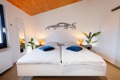 Ein Bett oder Betten in einem Zimmer der Unterkunft Racing-Chalet (Ferienhaus)