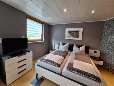 Ein Bett oder Betten in einem Zimmer der Unterkunft Ferienwohnung Rhens am Rhein