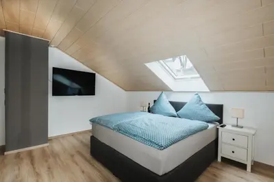 Ein Bett oder Betten in einem Zimmer der Unterkunft Ferienwohnung Krist