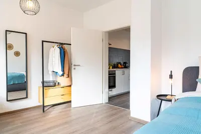 Ein Bett oder Betten in einem Zimmer der Unterkunft Deluxe Studio, PS4, Parken, Netflix, Klinikum