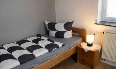 Ein Bett oder Betten in einem Zimmer der Unterkunft Ferienhaus Eifeljeföhl