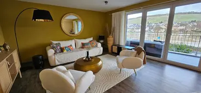 Ein Sitzbereich in der Unterkunft Elegant Apartment with Direct River View, Balcony and Parking in Bernkastel-Kues