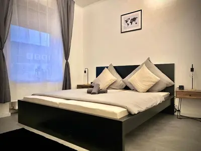 Ein Bett oder Betten in einem Zimmer der Unterkunft G&G Luxury Apartment am Stadtpark Bendorf