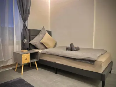 Ein Bett oder Betten in einem Zimmer der Unterkunft G&G Luxury Apartment am Stadtpark Bendorf