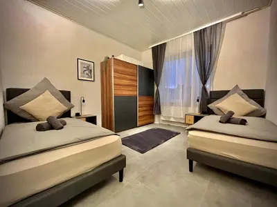 Ein Bett oder Betten in einem Zimmer der Unterkunft G&G Luxury Apartment am Stadtpark Bendorf