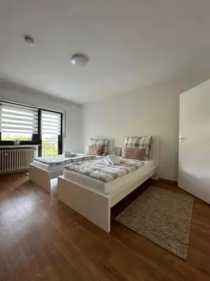 Ein Bett oder Betten in einem Zimmer der Unterkunft Ferienwohnung Panorama Oberkirn