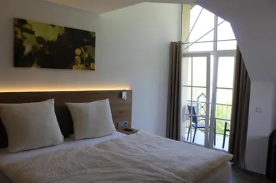 Ein Bett oder Betten in einem Zimmer der Unterkunft Ferienweingut Hansjosten