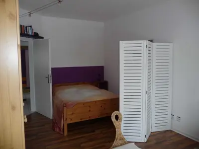 Ein Bett oder Betten in einem Zimmer der Unterkunft Sonnen-Ferienwohnung