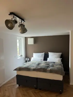 Ein Bett oder Betten in einem Zimmer der Unterkunft Julia's Mosel Villa Appartment MARK