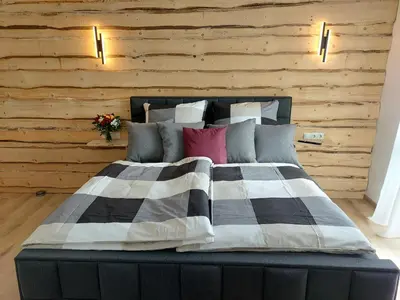 Ein Bett oder Betten in einem Zimmer der Unterkunft Premium Vulkaneifel Chalet
