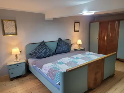 Ein Bett oder Betten in einem Zimmer der Unterkunft Quiddelbacher Mühle