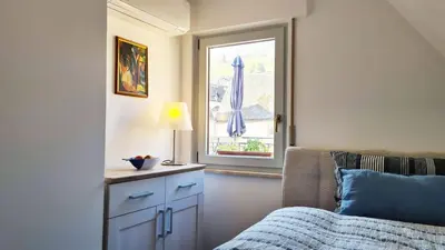 Ein Bett oder Betten in einem Zimmer der Unterkunft Weinstock - klimatisierte Ferienwohnung mit Sonnenterrasse