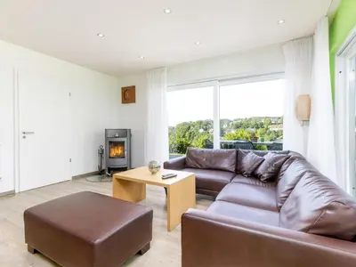 Ein Sitzbereich in der Unterkunft Luxusbungalow im Campingpark