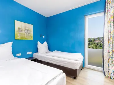 Ein Bett oder Betten in einem Zimmer der Unterkunft Luxusbungalow im Campingpark