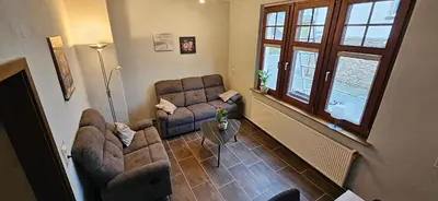 Ein Sitzbereich in der Unterkunft Ferienhaus In der Hohl