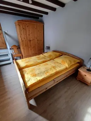 Ein Bett oder Betten in einem Zimmer der Unterkunft Ferienhaus In der Hohl
